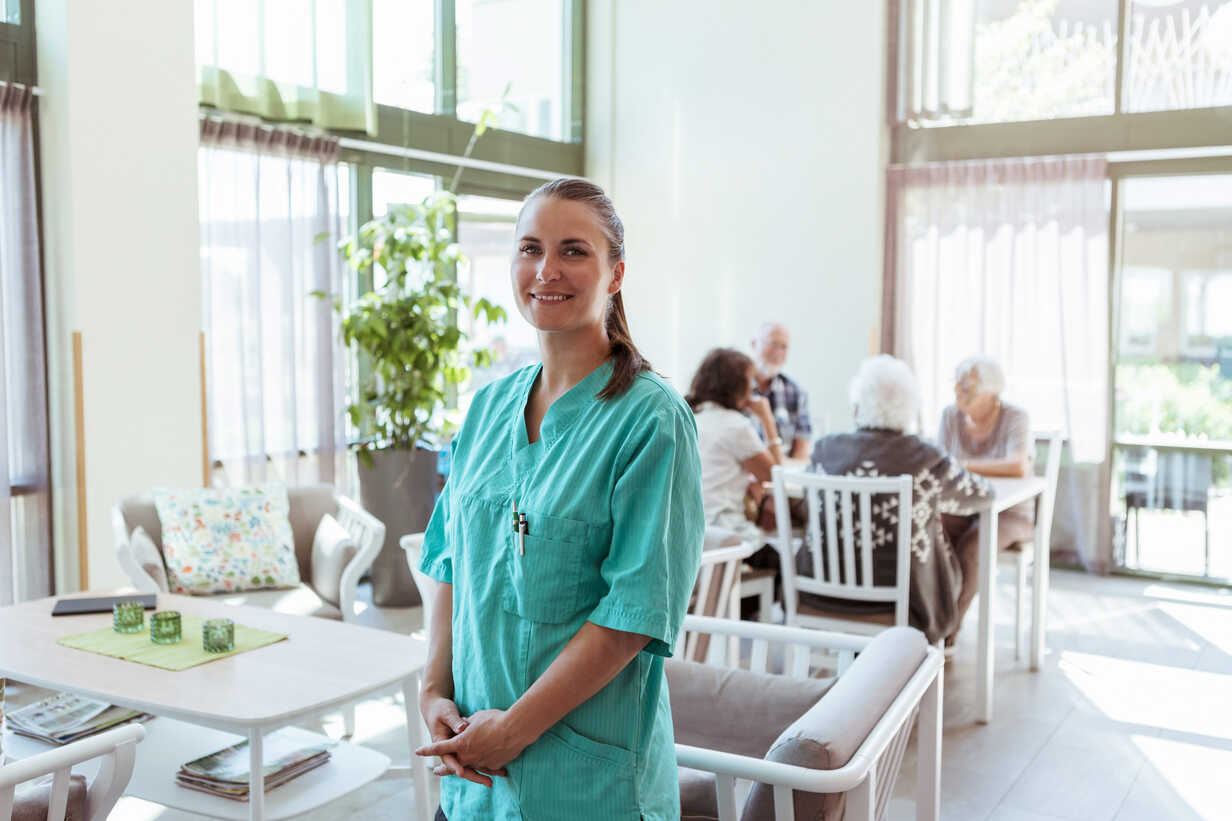 Elder care employee working with seniors at home